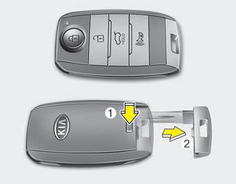 To remove the mechanical key, press and hold the release button(1) and remove